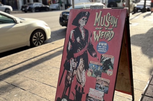 Sidewalk sign for Museum Of The Weird